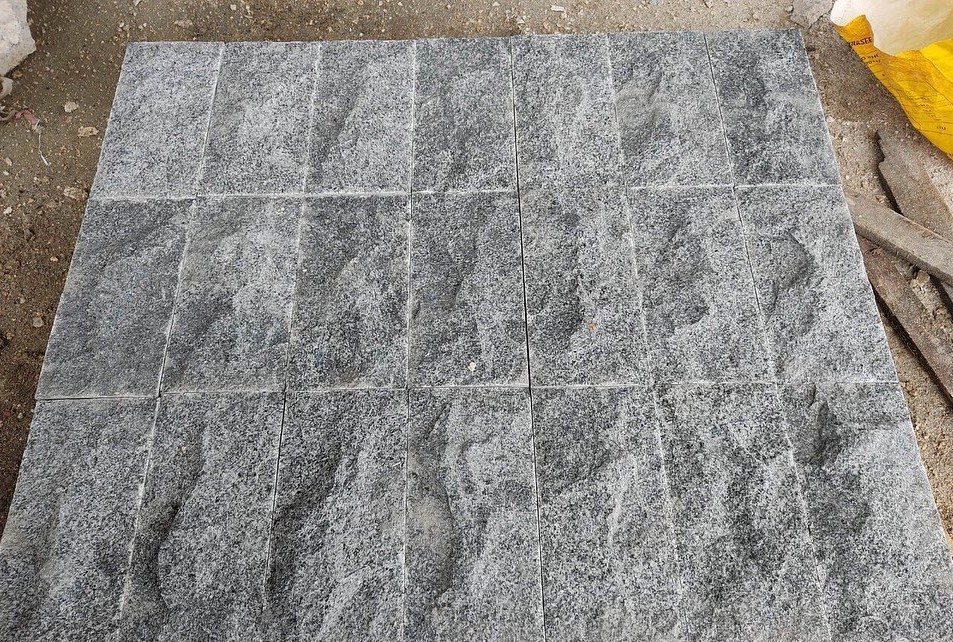 Bush hammered Dark grey granite paving slabs